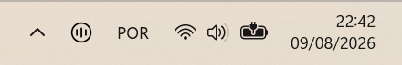 Windows tray icon in the notification area — a bar-chart-in-circle mark beside the overflow chevron