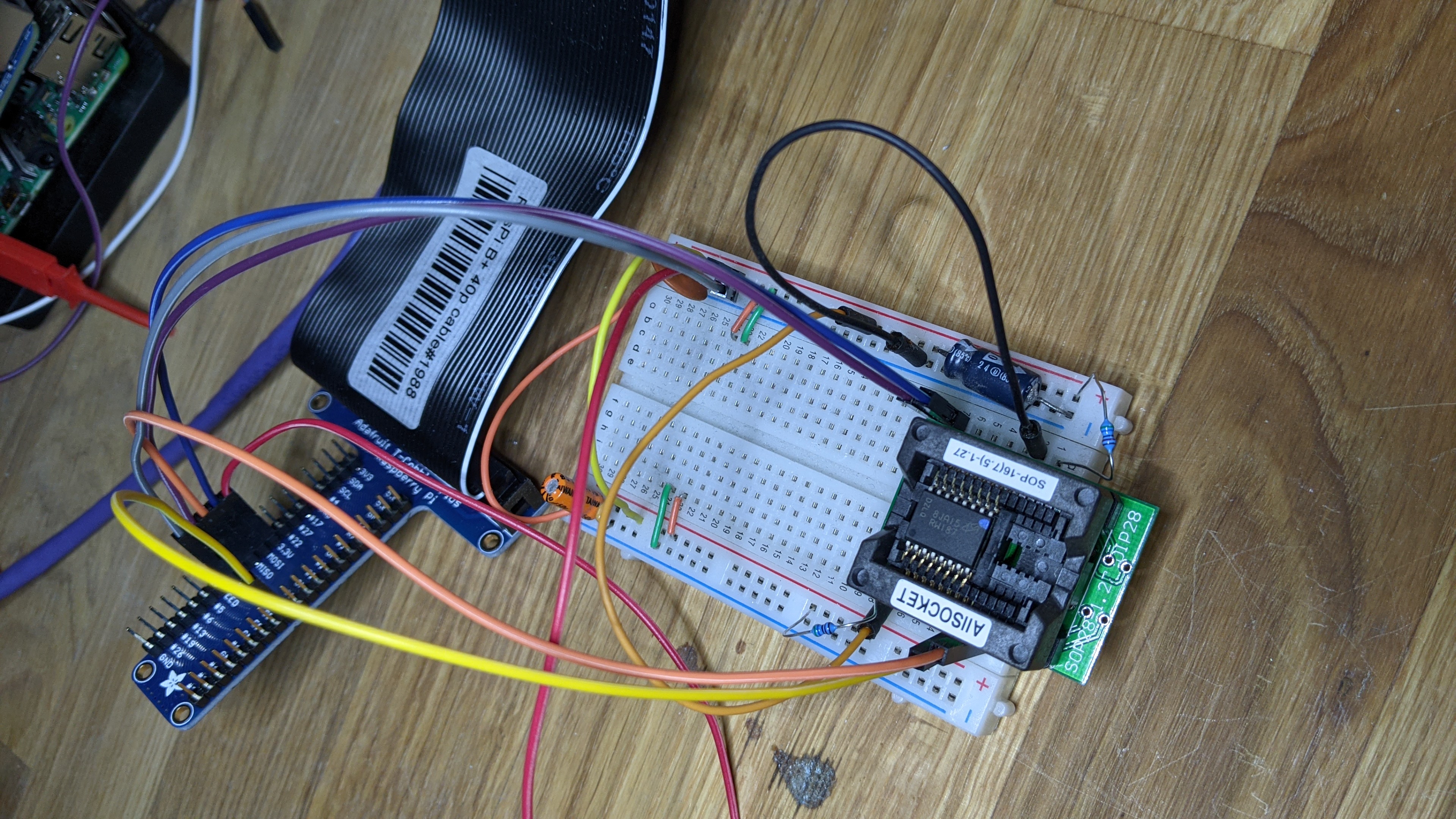 Raspberry Pi T-Cobbler attached to solderless breadboard with SPI flash chip socket attached