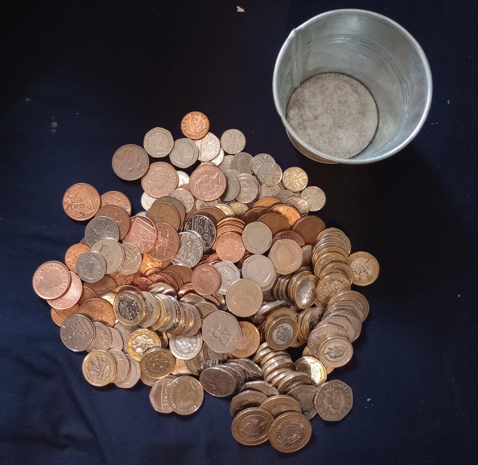 The pile of coins and change pot