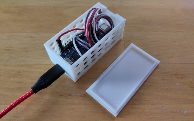 Photo of an assembled CO2 sensor with the lid removed, powered by USB-C cable