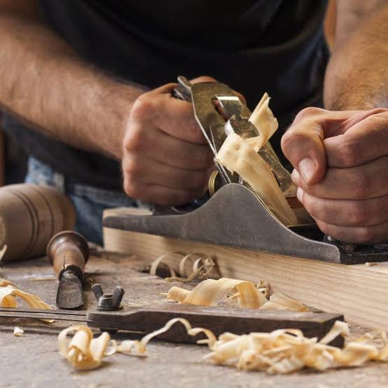 Fasil furniture workshop with artisan working on wood