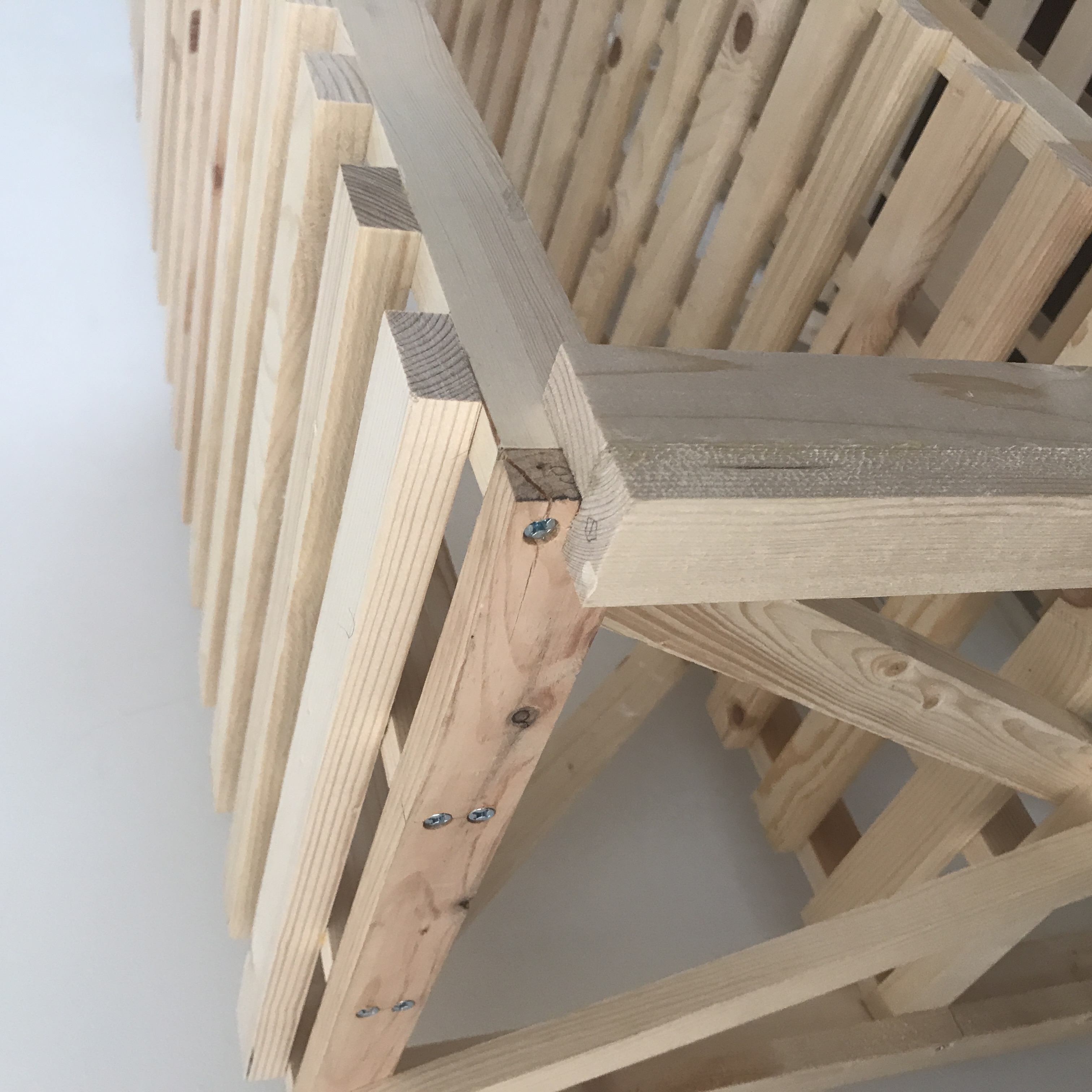 photo of the top corner of the wooden standing shelf