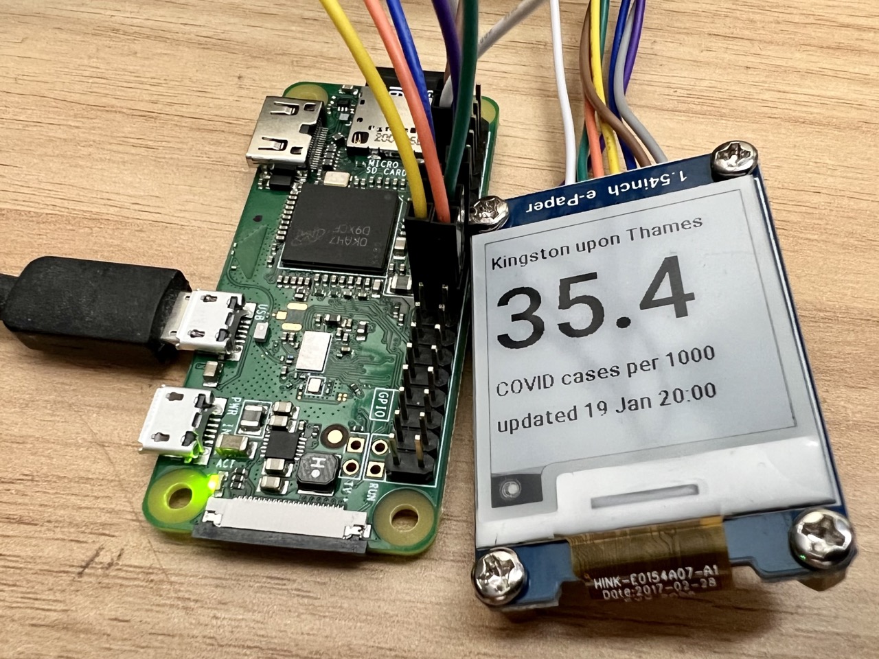 Pi Zero W with Waveshare 1.54" e-paper display showing case numbers