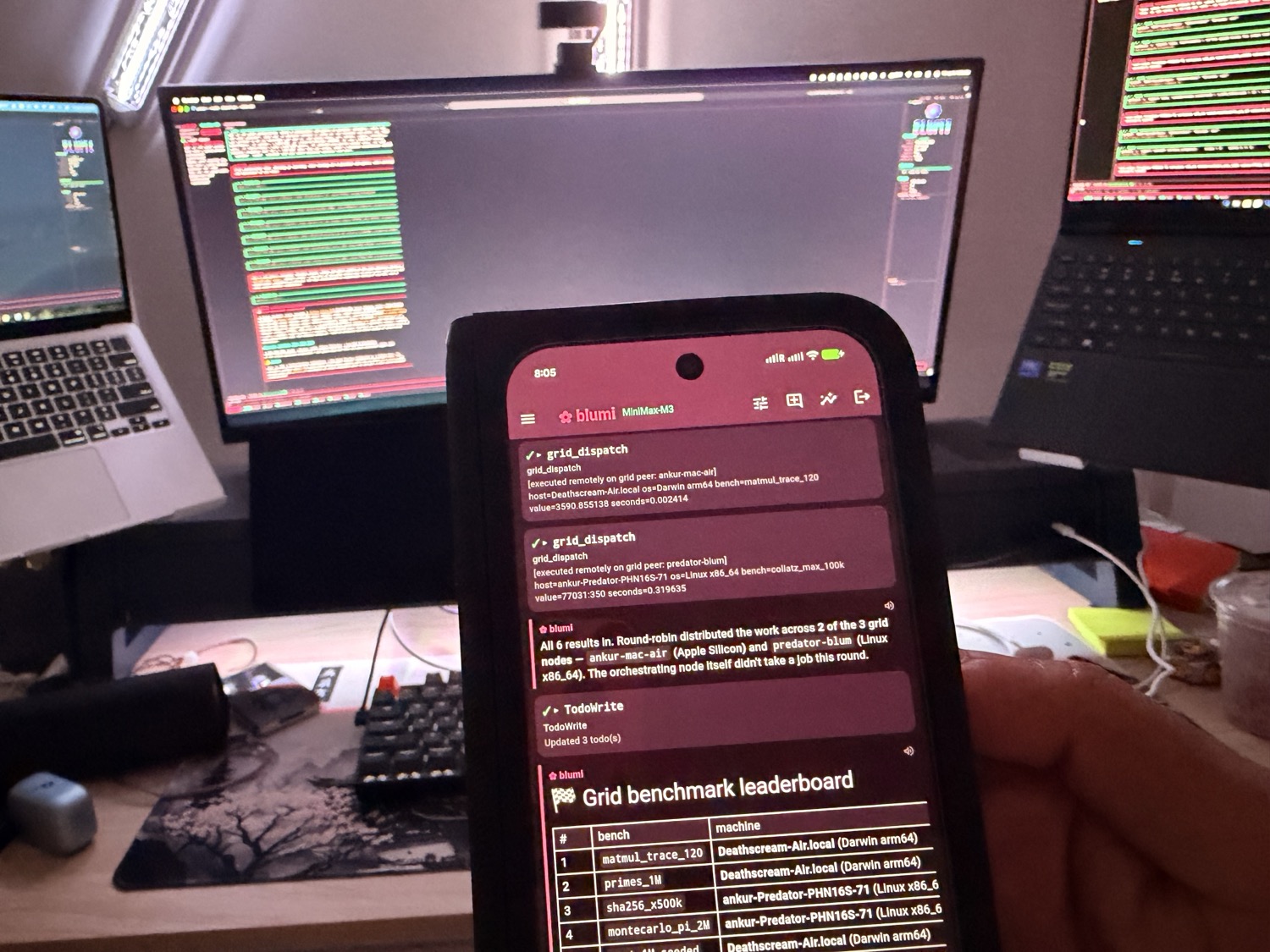 driving the grid from the phone with three machines computing behind it