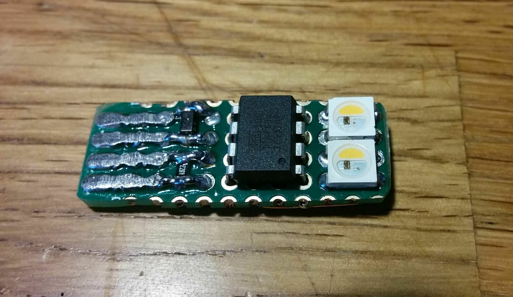 The top side of the usbpixel prototype showing the ATtiny85 and two NeoPixel LEDs.