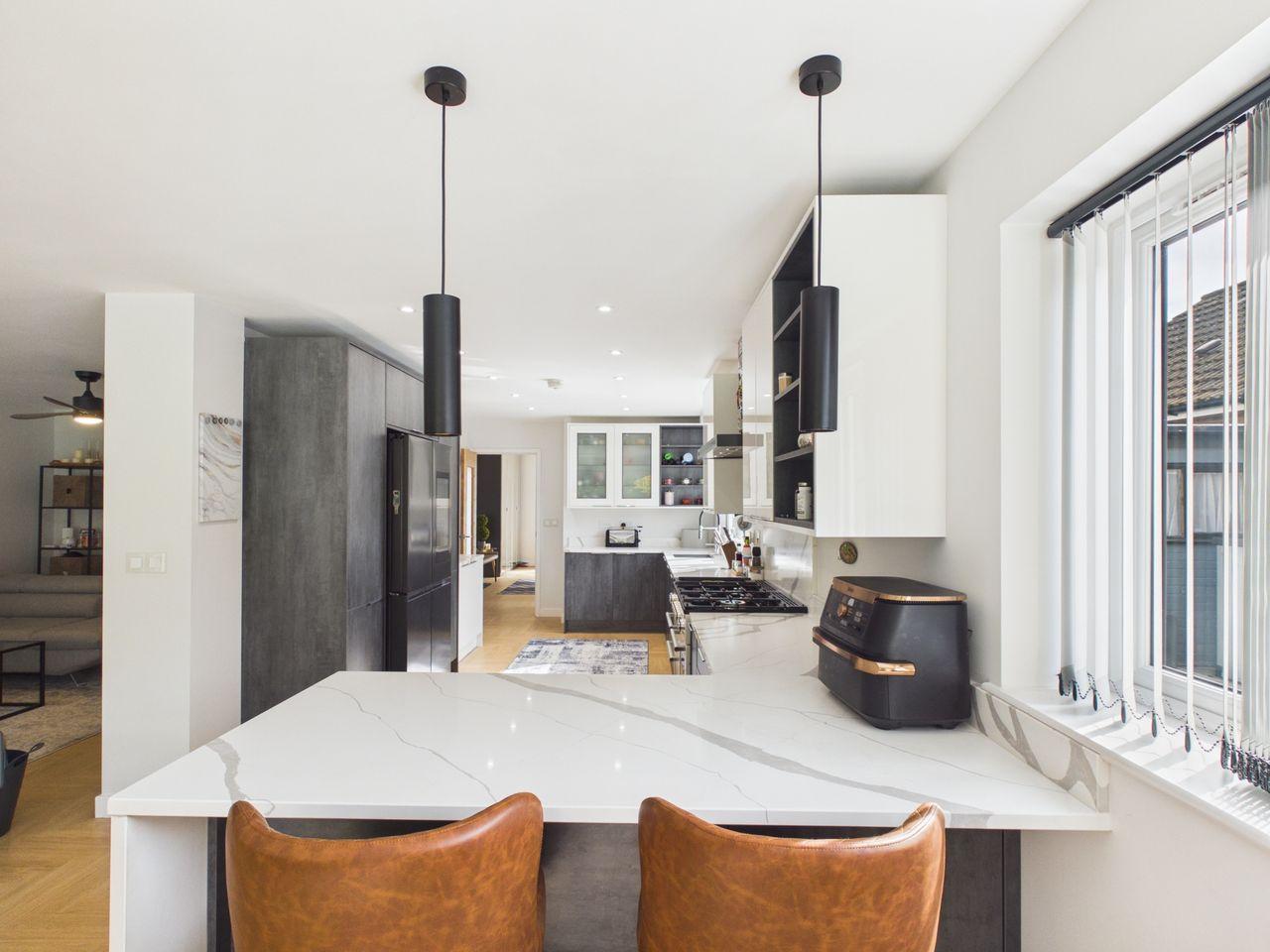 Whalley Drive, Bletchley — kitchen island with marble-effect worktop and breakfast bar seating
