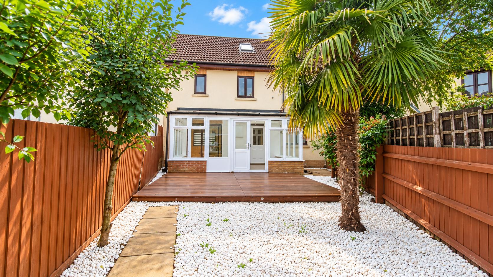Edzell Crescent, Westcroft — private rear garden with decked terrace and the conservatory beyond