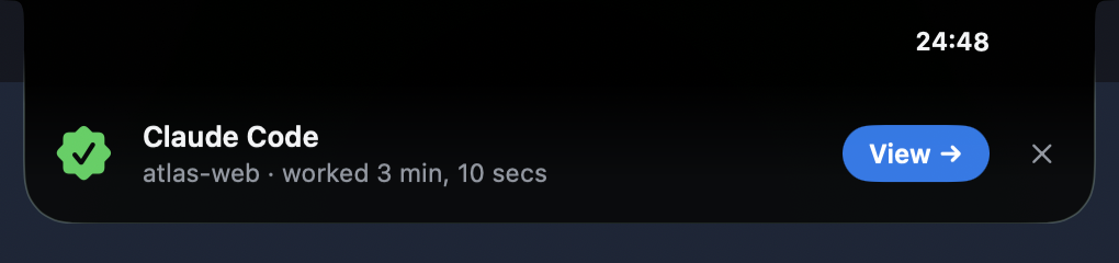 A celebration from the notch: a green seal, 'Claude Code, atlas-web, worked 3 min, 10 secs', and a View button.