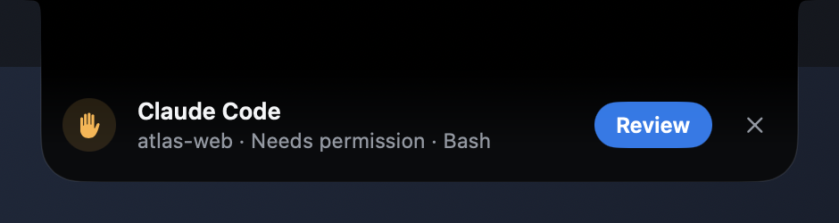 A notification grown from the notch: Claude Code, atlas-web, needs permission for Bash, with a blue Review button.