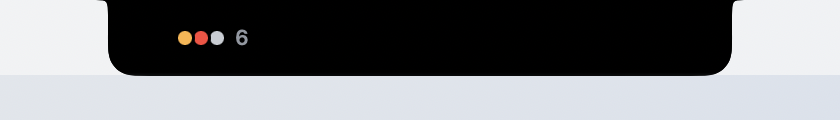 At rest: the notch with three small status dots and a count of six.