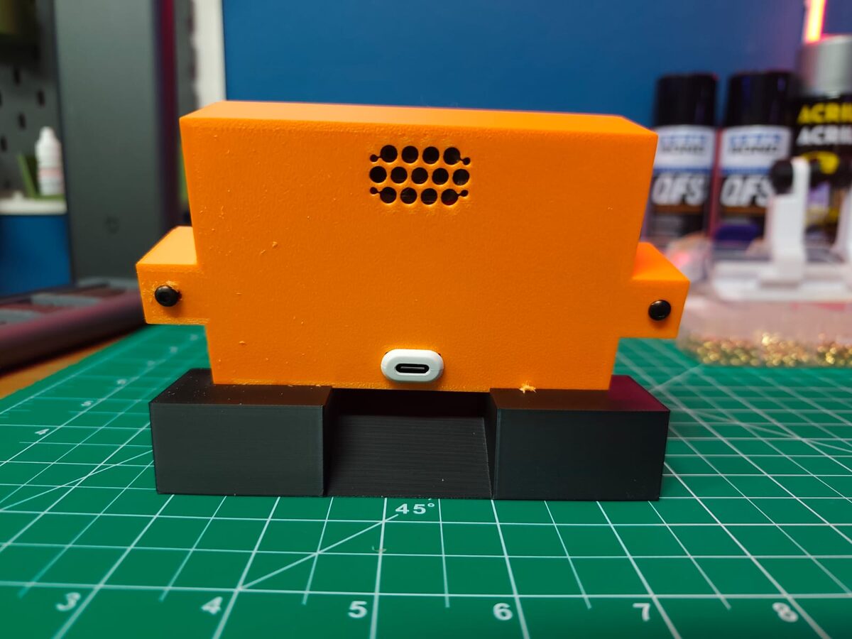 Back of the case: speaker grille and the USB-C power input