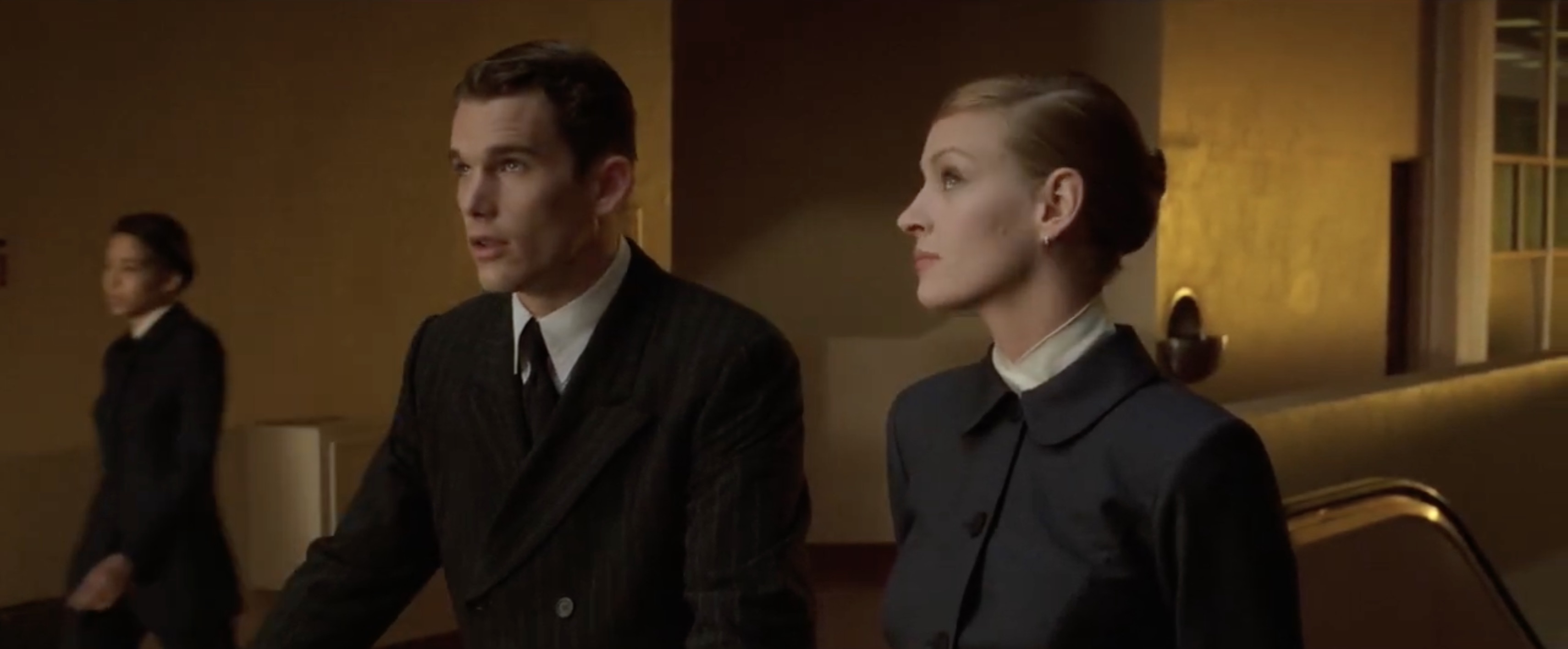 Costumes and sets evoke a mid-century elegance, and the yellowish tint gives the film a distant, melancholic tone.