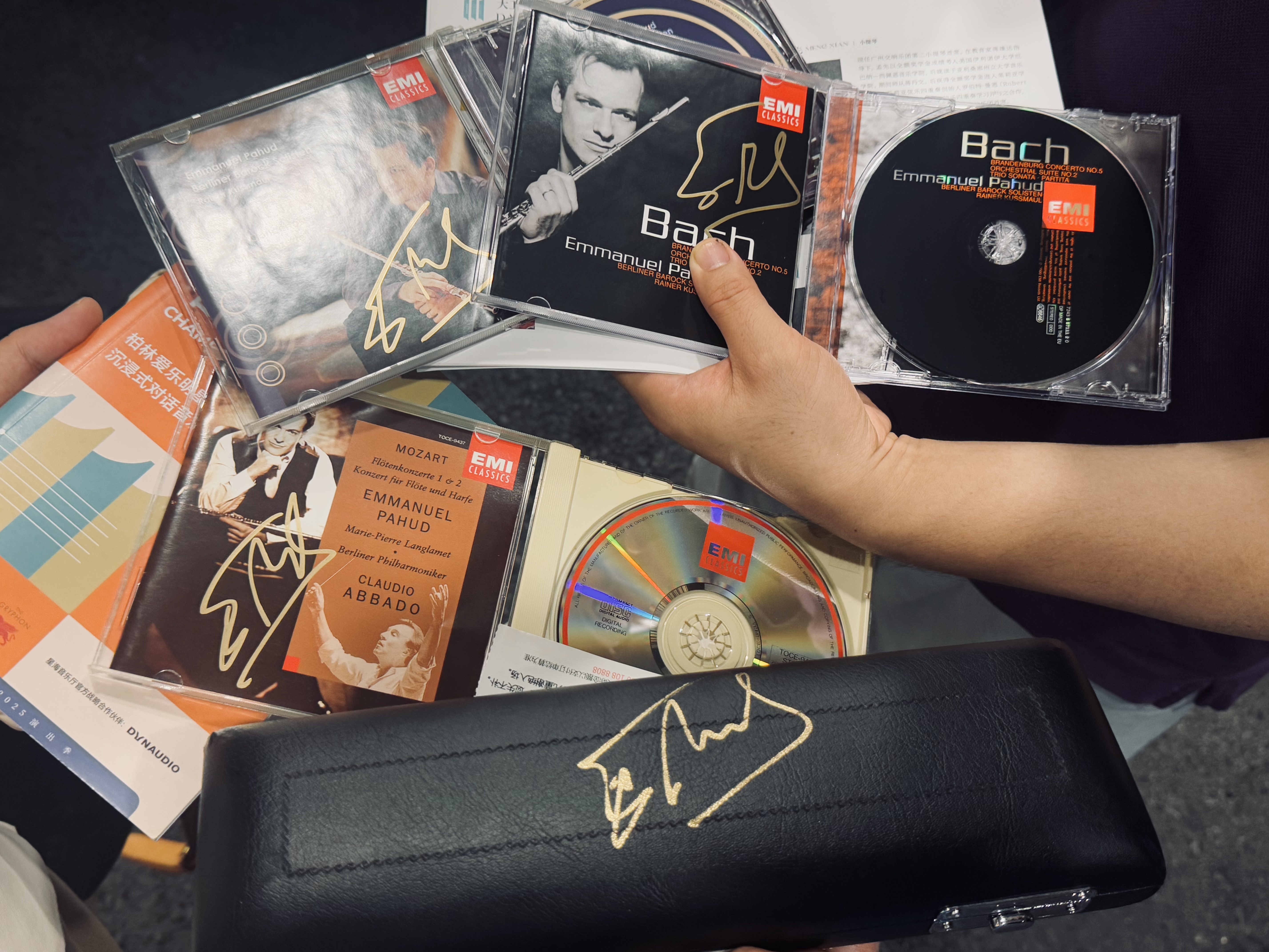 He signed on my piccolo box