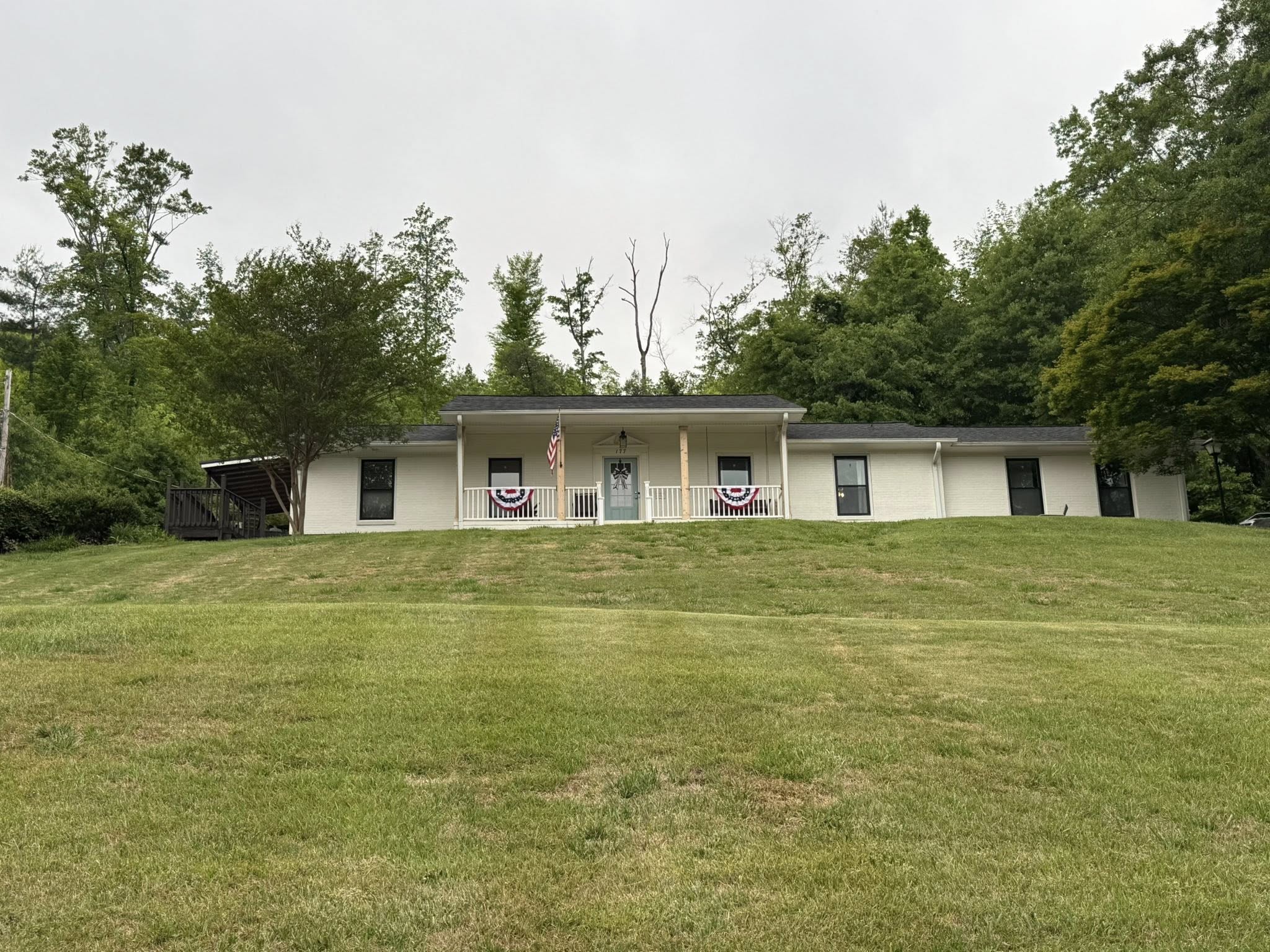 White homestead house on the hill