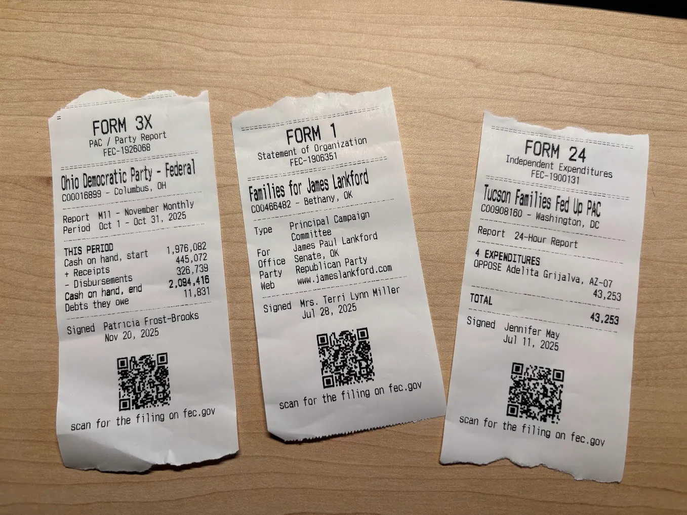 Three printed receipts each displaying information about an FEC filing, with a QR code to each filing on fec.gov