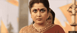 A woman displaying intense emotion in a traditional setting.