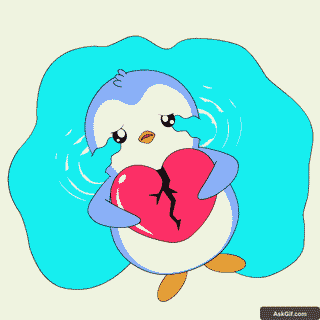 A sad penguin holds a broken heart, symbolizing heartbreak.