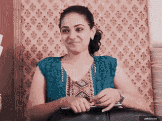 Nithya Menen Smiles Playfully While Holding a Notebook