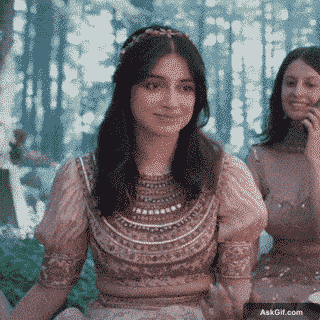 Divya Khosla Kumar Smiles Warmly While Sitting in a Forest Setting