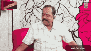 Bharathi Kannan Sits Back and Smiles While Listening Attentively