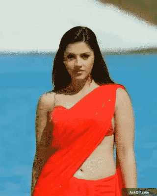 Mehreen Pirzada Struts Confidently in a Red Saree by the Water
