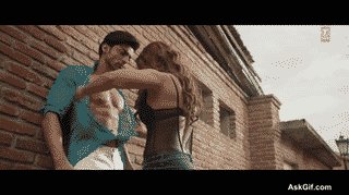 Sana Khan Playfully Teases While Unbuttoning a Shirt