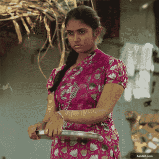 Rinku Rajguru Stands Firmly With a Serious Expression Holding a Plate