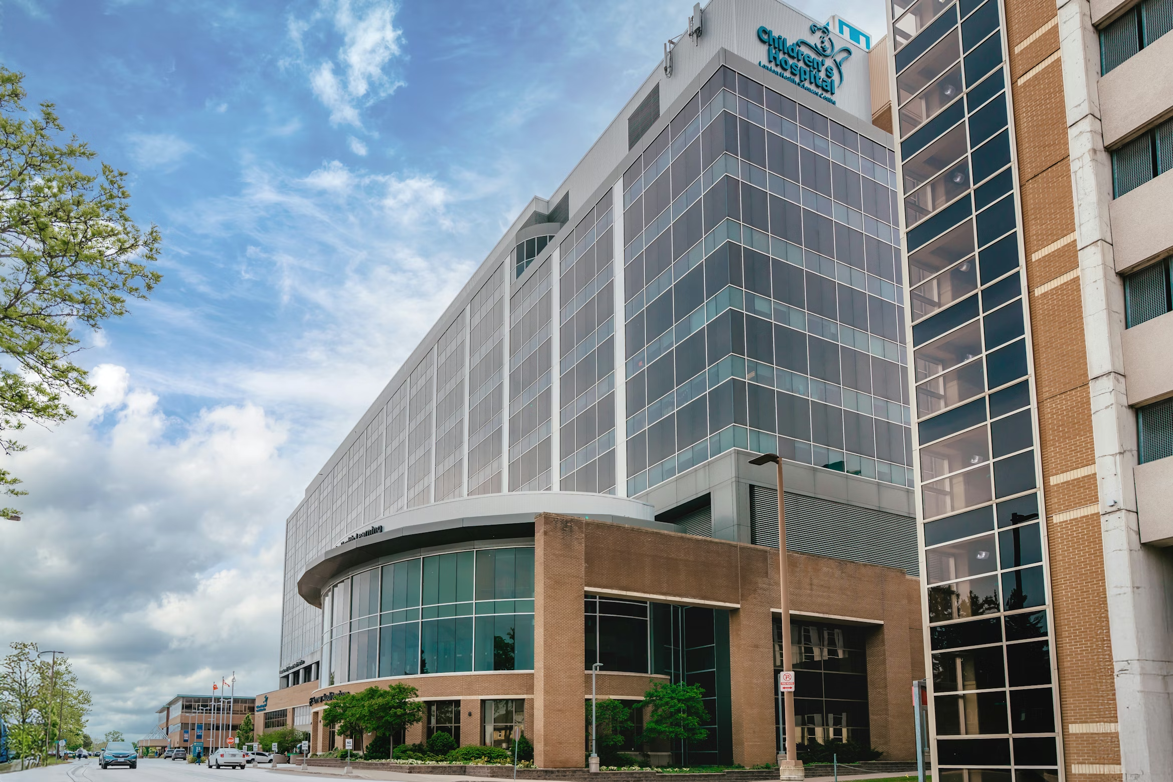 Modern multi-specialty hospital campus with glass façade and landscaped entry in Melbourne.