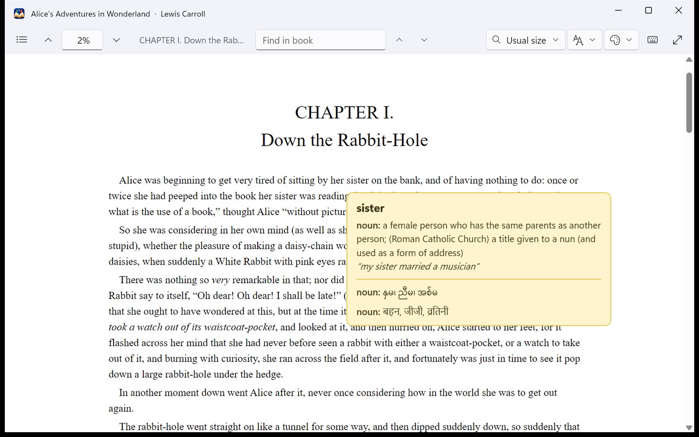 Alice's Adventures in Wonderland in the reader, with the word sister defined in English, Myanmar and Hindi