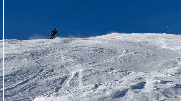 Split-screen wipe: a skier carving down a slope, one side redacted by OpenScrub with a body-shaped silhouette blur that tracks them through the turn while the snow, skis and poles stay sharp