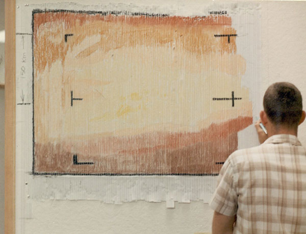 A member of the JPL team hand-rendering the first image of Mars with a pastel crayon.