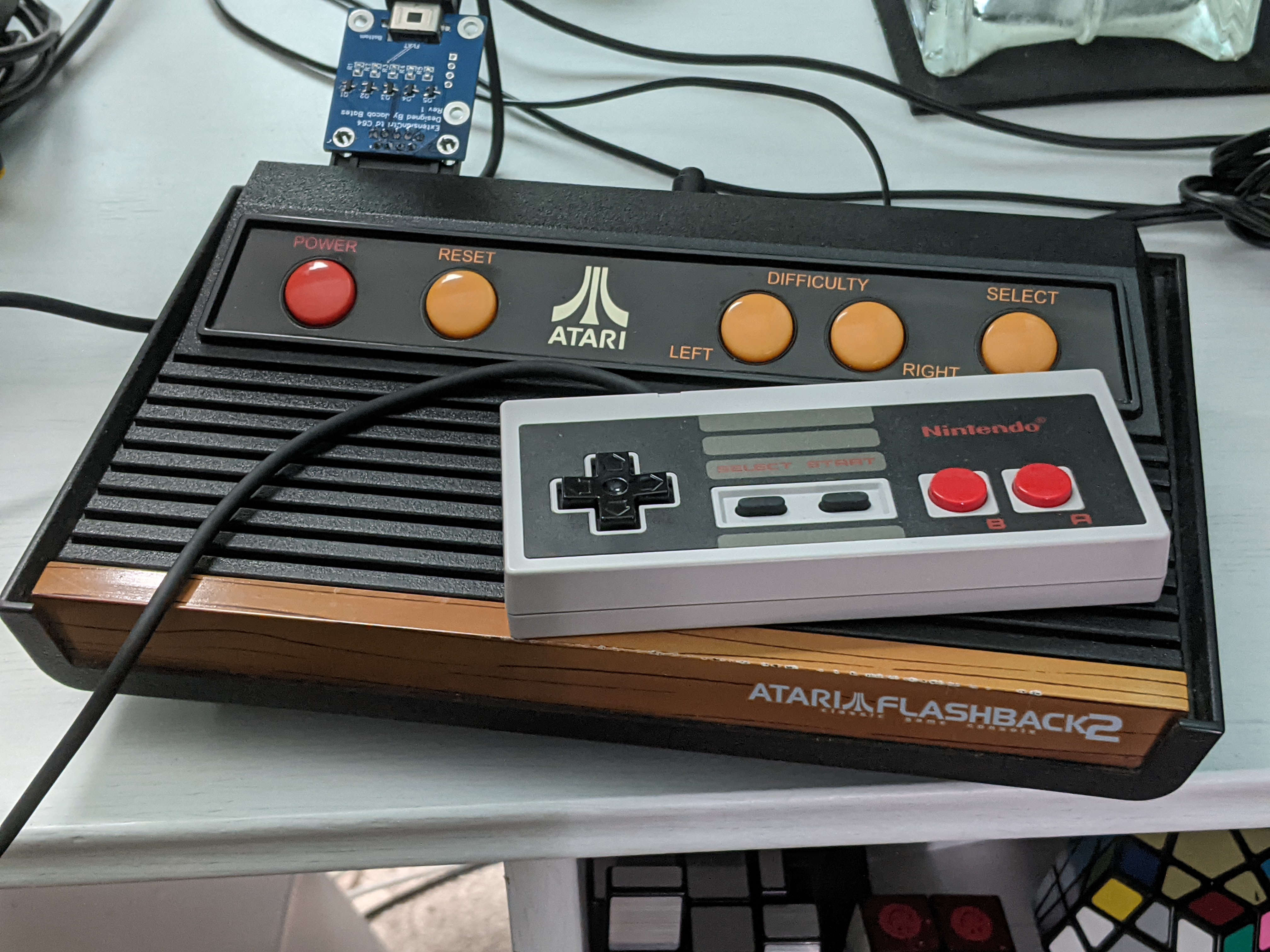 The adapter plugged into an Atari Flashback 2