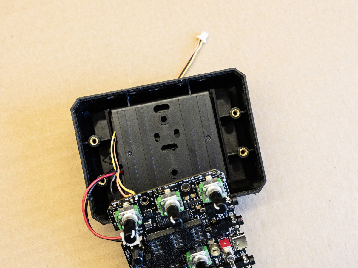 Cable through battery hole