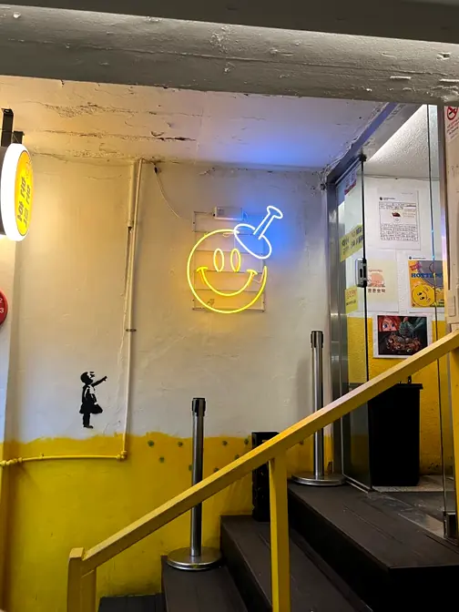 Hunhun Hotteok interior neon smiley stairs
