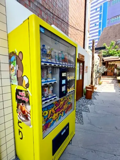 Yellow vending machine in bakery alley