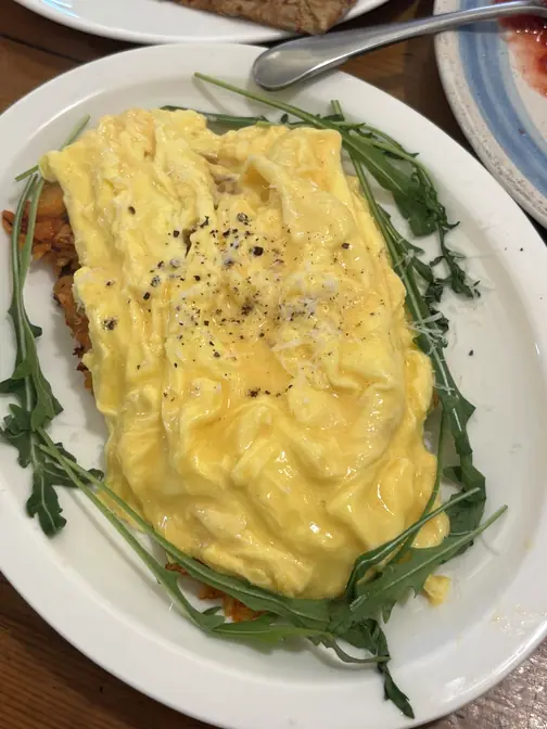 Fluffy omelet with green arugula