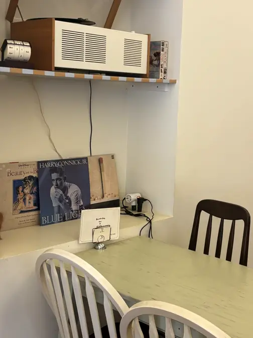 Retro record player on white shelf