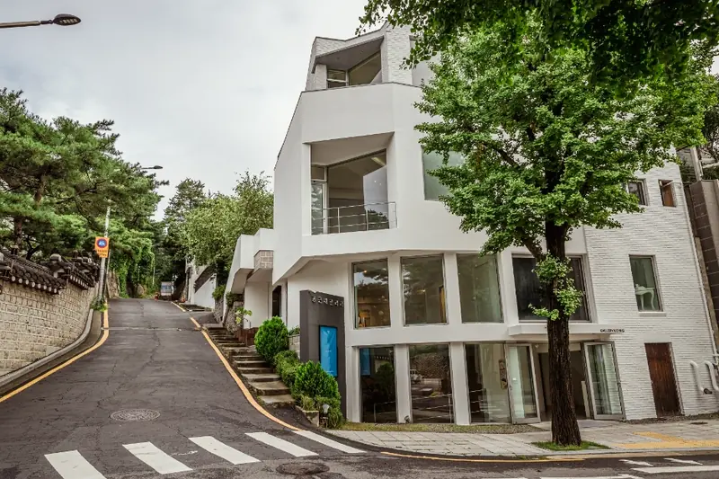 Gallery building on sloping street view