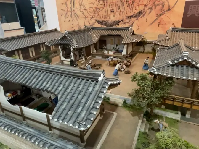 Detailed diorama of historical herb market