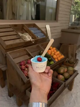 Hand holding blue summer scoop dessert