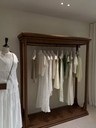 Minimalist interior with mannequin and rack