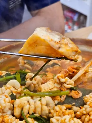 Cooked codfish piece chopsticks stew