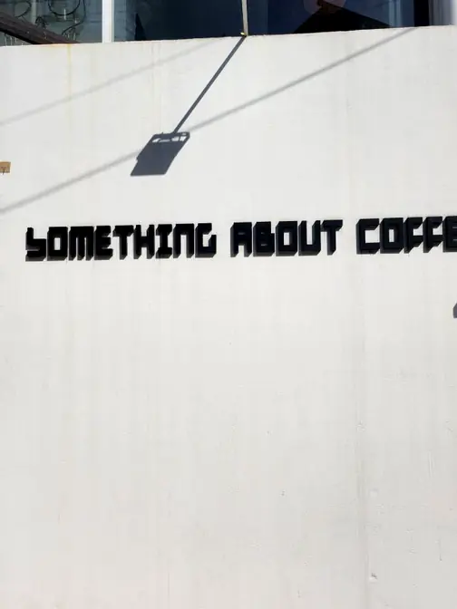 Something About Coffee brand signage