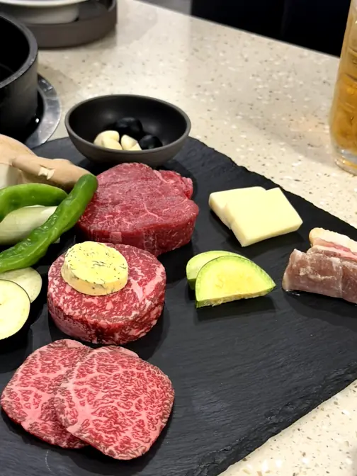 Raw Hanwoo beef platter with vegetables