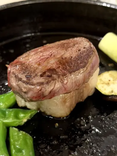 Hanwoo steak searing on iron grill