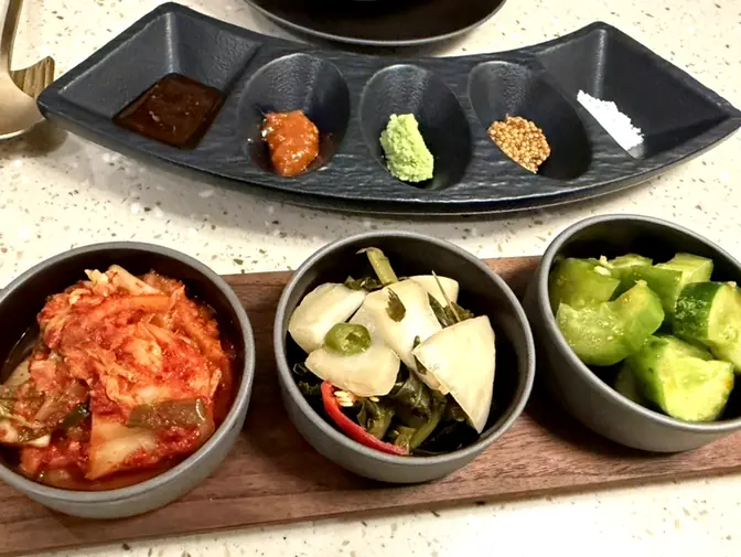 Assorted Korean side dishes on table