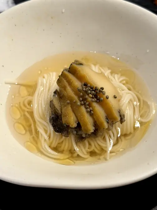 Abalone noodles with perilla seed topping