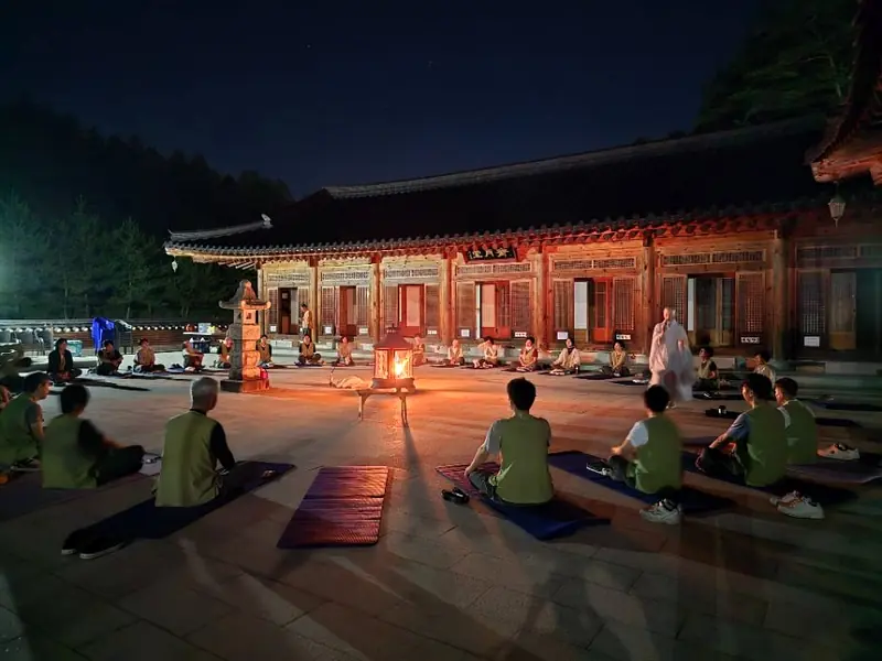 Night temple courtyard ritual gathering