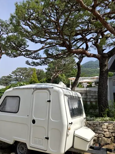 Vintage white caravan in garden
