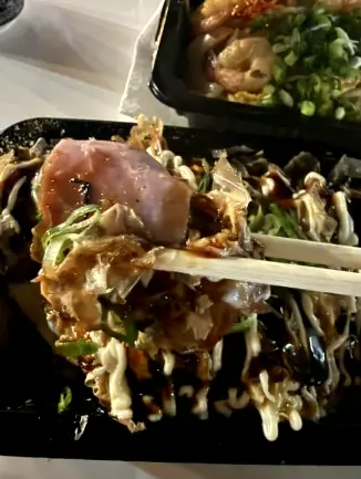 Takoyaki topped with green onions